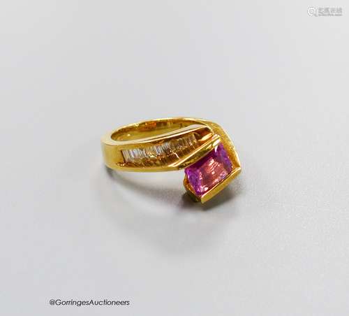 A modern 18k gold, emerald cut pink sapphire set dress ring,...