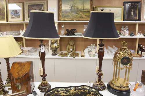 A pair of carved and giltwood table lamps and shades, overal...