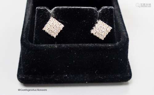 A modern pair of 18ct white gold and diamond encrusted squar...