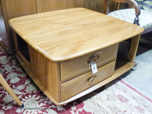 An Ercol elm Windsor storage coffee table, width 78cm, depth...