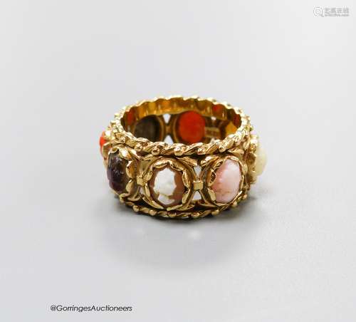 A 14kt yellow metal and multi cameo stone set eternity ring,...