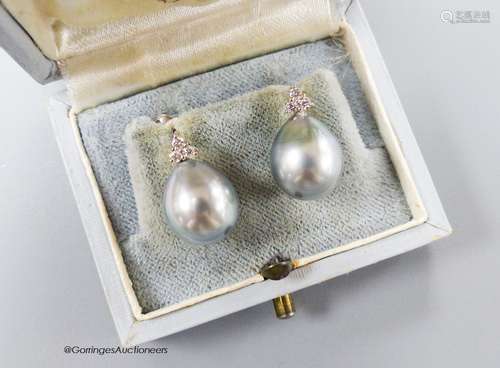 A pair of white metal, cultured Tahitian pearl and diamond c...