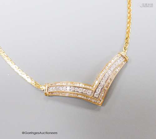 A 10k yellow metal diamond set 'herringbone' necklet, on a 1...