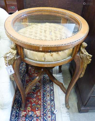 An early 20th century circular bijouterie table with applied...