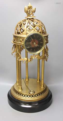 A large gilt metal Portico mantel clock, with slate and roug...