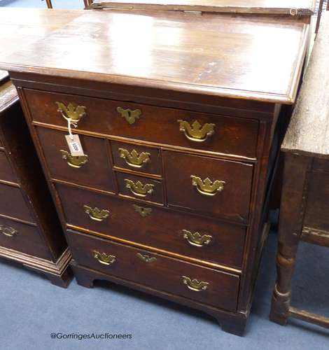 An 18th century East Anglian oak chest,fitted with an arrang...