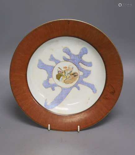 A Chinese famille rose plate, decorated with character mark ...