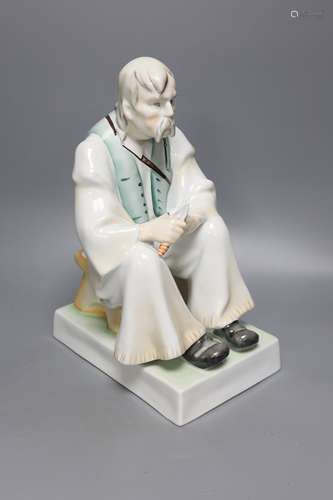 A Zsolnay porcelain figure of a seated peasant, height 33cm