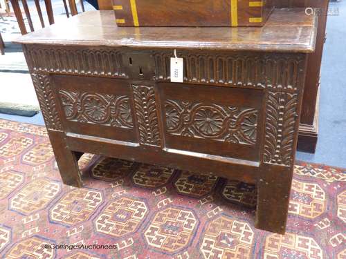 A 17th century carved boarded and panelled oak chest with re...