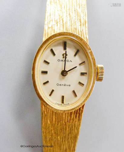 A ladys' 18ct gold Omega wristwatch,having oval cream dial a...