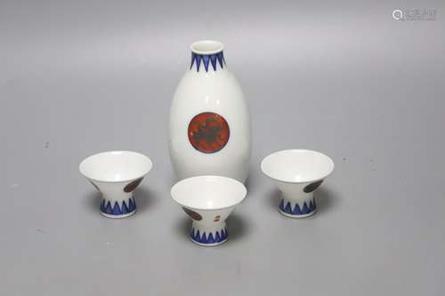 A Japanese blue and white porcelain sake flask, with associa...