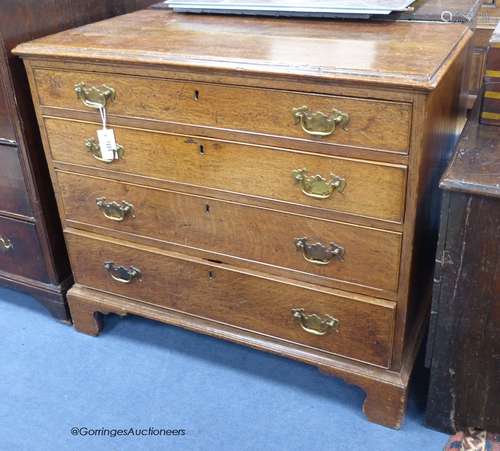 A George III oak chest fitted four graduated long drawers, w...