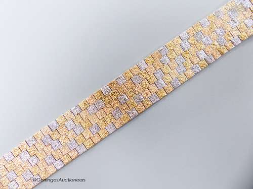 A three-colour 9ct yellow and white gold mesh bracelet, 17.7...