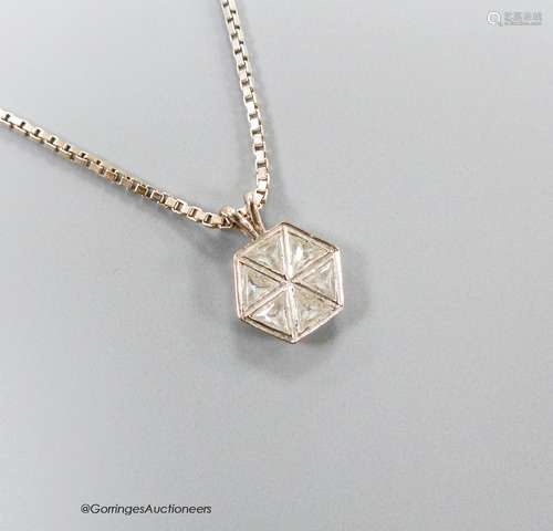 A white metal and six stone triangular diamond set hexagonal...