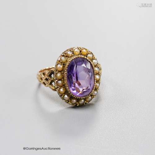 A 19th century yellow metal, amethyst and seed pearl set ova...