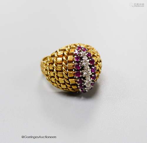 An early 1970's 14ct gold, ruby and diamond set dress ring, ...