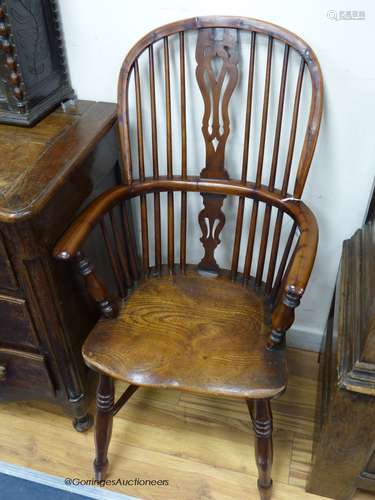 An early 19th century yew and elm Windsor armchair, with cri...