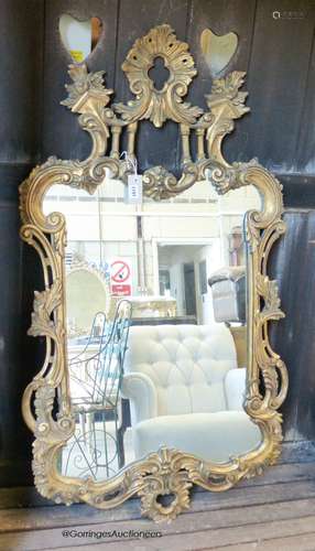 A George III style carved gilt wood mirror. W-70, H-124cm.