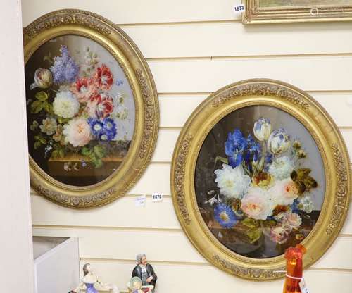 A pair of Victorian reverse painted oval glass flower painti...