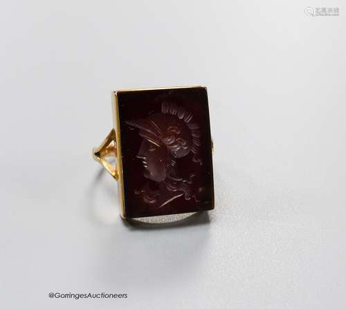 A 9ct yellow metal and intaglio hardstone signet ring, carve...