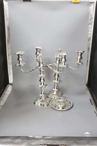 A pair of silver plated candelabra, two plated salvers and t...