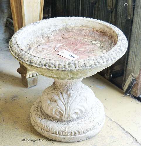 A circular reconstituted stone garden bird bath, diameter 38...