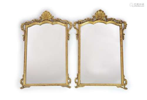 A pair of Georgian style carved giltwood wall mirrors,with s...