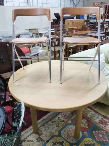 A circular beech breakfast table, depth 122cm, and two Itali...