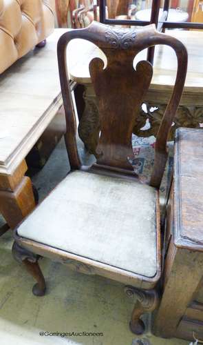 A set of four George I walnut dining chairs on front cabriol...