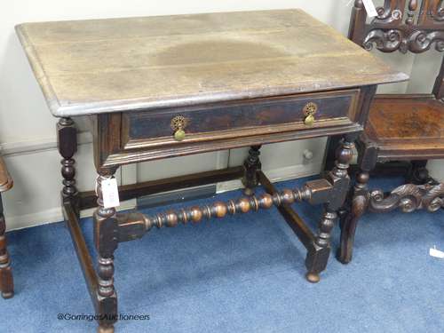 A Charles II rectangular oak side table on bobbin-turned leg...