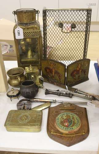 A Victorian brass spit guard, a brass railway lamp, a brass ...