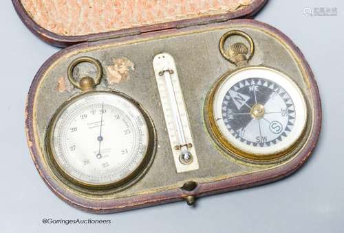 An Edwardian leather cased pocket barometer, thermometer and...