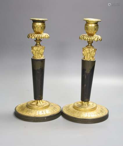 A pair of 19th century bronze and ormolu figural candlestick...