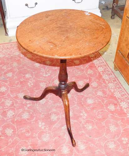 A George III oak circular topped wine table, Diam.51cm H.68c...