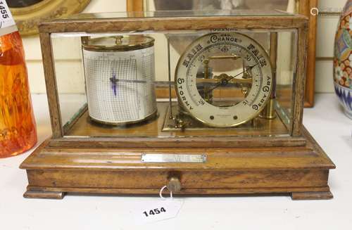 A commemorative walnut cased barograph for Commander John Br...