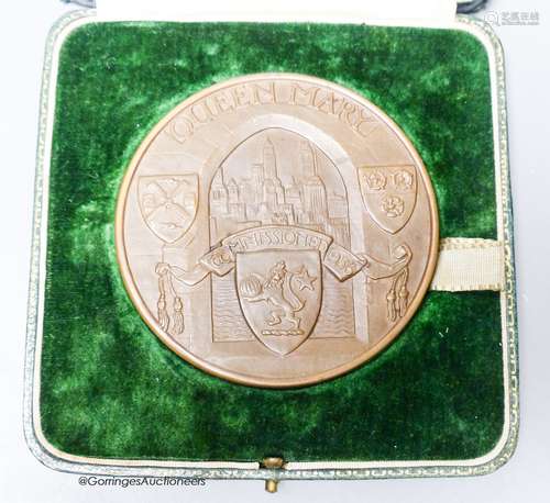 A cased RMS Queen Mary maiden voyage 1936 bronze medal desig...