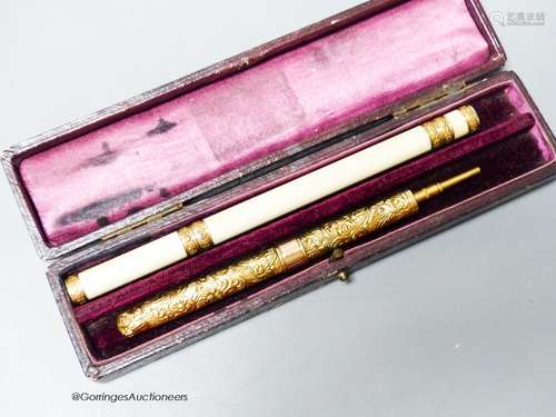 An antique French gold mounted ivory combined pen/pencil and...