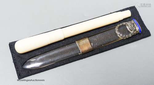 An early 20th century ivory eye dropper pen and an enamelled...