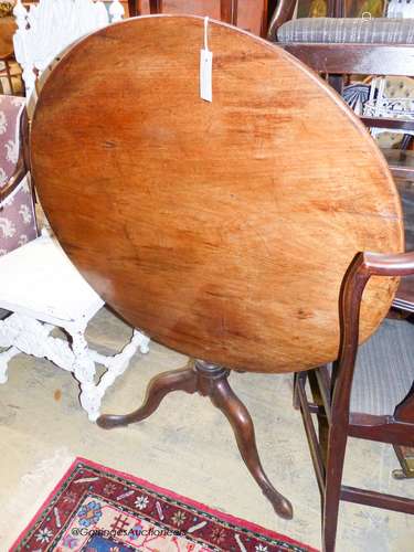 A George III circular mahogany tilt top tea table, Diam.85cm...