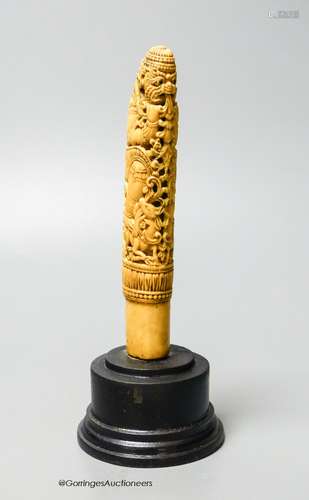 A 19th century Indonesian ivory Dha handle, on plinth, heigh...