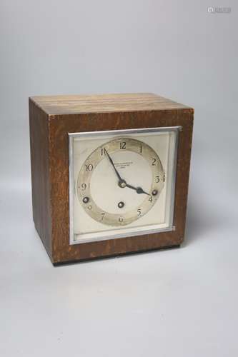 An Art Deco oak cased clock, with ebony banded borders, Arth...