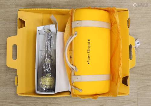 A Veuve Clicquot Champagne set and a boxed bottle of Champag...