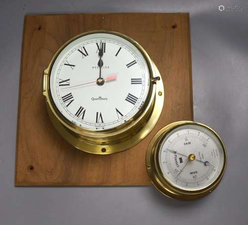 A Westclock brass wall timepiece and a barometer