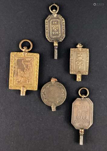 FRANCE. Cinq clés de montre en bronze- et bronze doré à déco...
