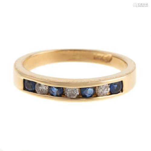 A Sapphire & Diamond Channel Set Band in 14K