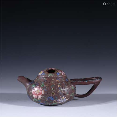 A Carved Yixing Zisha Teapot with Flower Pattern