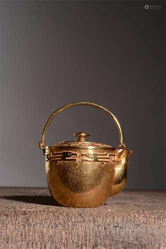 A Gilt Silver Teapot with Handle