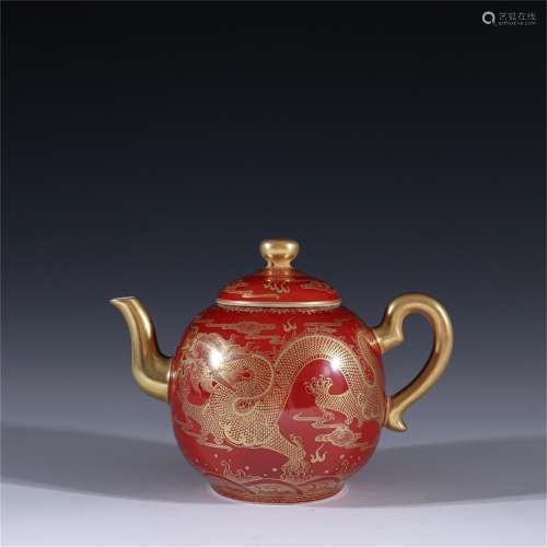 A Red Glazed Porcelain Teapot with Dragon Pattern