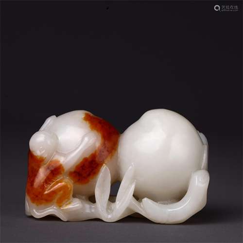 A Carved Jade Peach Shaped Decoration