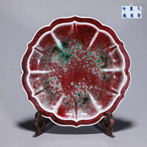 A flower shaped red porcelain plate